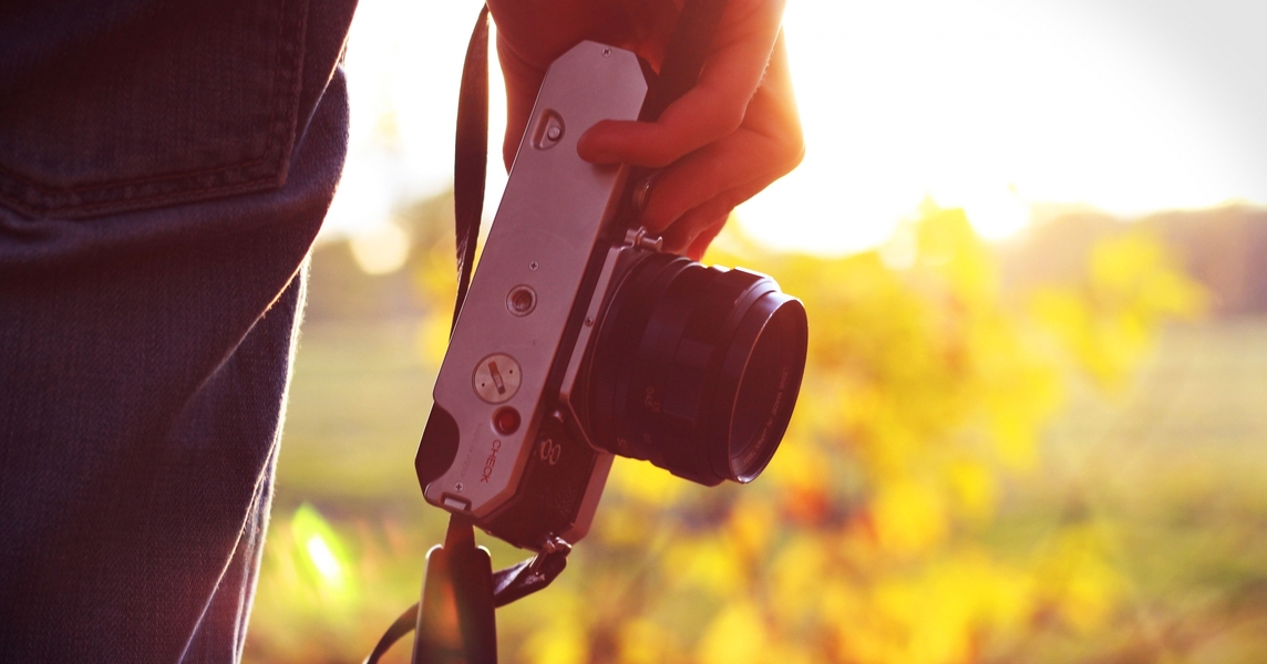 man-holding-the-camera-during-the-sunset-103-medium.jpg